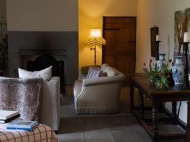A living room with a sofa and lamp at North Cottage Myddfai near Llandovery