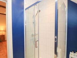 A shower in a bathroom at Peewit Coach House in Moreton-in-Marsh