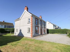 A house with a garden and driveway at Hawthorns Swansea