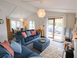 A living room with a sofa and coffee table at Charnwood