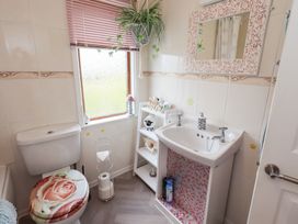 A bathroom with a toilet and sink at Charnwood in 