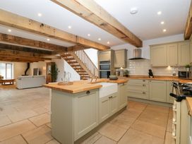 A kitchen with cabinets and a countertop at Two Parks Barn in Upton Bishop near Ross-On-Wye