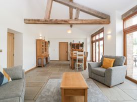 A living room with seating and dining furniture at Two Parks Barn Upton Bishop near Ross-On-Wye