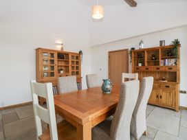 A dining room with a table and chairs at Two Parks Barn Upton Bishop near Ross-On-Wye