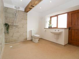 A bathroom with a shower, toilet, and sink at Two Parks Barn in Upton Bishop near Ross-On-Wye