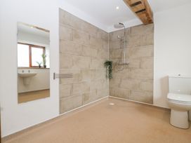 A bathroom with a shower, sink, and toilet at Two Parks Barn Upton Bishop near Ross-On-Wye