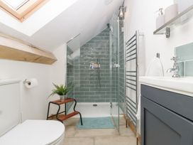 A bathroom with a shower and toilet at Two Parks Barn in Upton Bishop near Ross-On-Wye