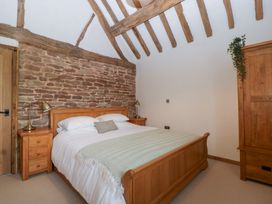 A bedroom with a bed and bedside tables at Two Parks Barn Upton Bishop near Ross-On-Wye