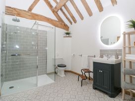 A bathroom with a shower, toilet, and sink at Two Parks Barn Upton Bishop near Ross-On-Wye