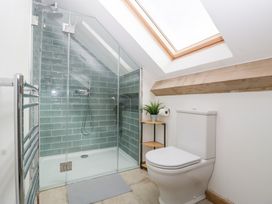 A bathroom with a shower and toilet at Two Parks Barn in Upton Bishop near Ross-On-Wye
