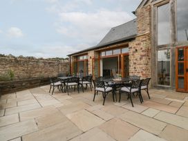 An outdoor patio with seating at Two Parks Barn in Upton Bishop near Ross-On-Wye