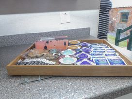 A tray with tea bags and cookies at Bryncrin Edern