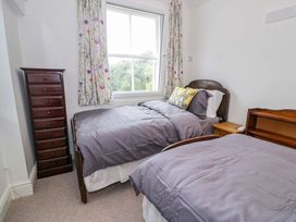 A bedroom with two beds and a drawer at Bryn Dwr in Llangollen