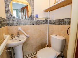 A bathroom with a sink and toilet at Bryn Dwr in Llangollen