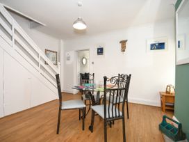 A dining room with a table and chairs at Seahorse in Filey