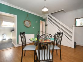 A dining room with a table and chairs at Seahorse in Filey