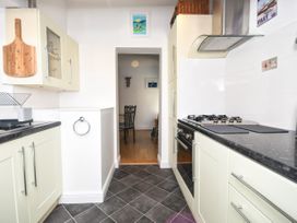 A kitchen with an oven and a sink at Seahorse in Filey