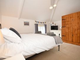 A bedroom with a bed and wardrobe at Seahorse Filey