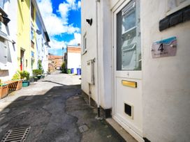 An alley with a door and sign at Seahorse in Reynolds Yard