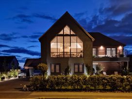 A house with large windows and garden at Calm Waters Luxury Beach House in Bridlington