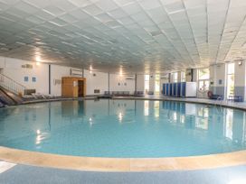 An indoor swimming pool with changing rooms at 21 Tamar & St. Anns Cottages Honicombe Park near St. Ann's Chapel, Cornwall