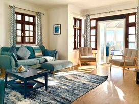 A living room with a sofa and coffee table at Crows Nest Dawlish