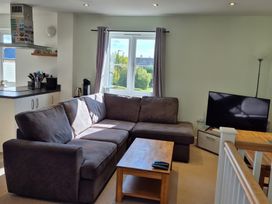 A living room with a sofa and coffee table at 54 swallow road