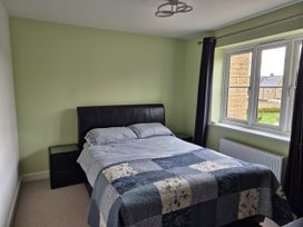 A bedroom with a bed and window at 54 swallow road