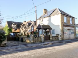 A building with a gate and sign at Swallows Nest in Bourton-On-The-Water