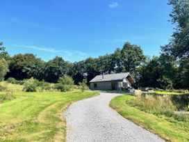 A house surrounded by grass and trees at Cadno in Aber near Llanybydder