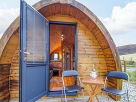 An entrance with chairs and a table at The Pod at Greenbank in Isle of Skye