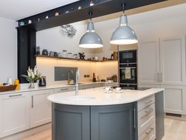 A kitchen with an island and sink at Duke's Barn Blackawton near Dartmouth