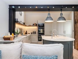 A kitchen with an island and modern appliances at Duke's Barn Blackawton near Dartmouth