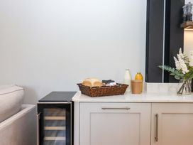 A kitchen counter with bread and drinks at Duke's Barn Blackawton near Dartmouth