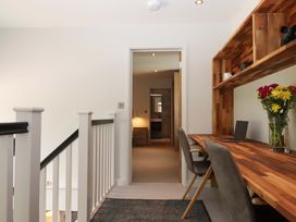 A hallway with a desk and chair at Duke's Barn in Blackawton near Dartmouth