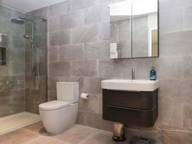 A bathroom featuring a shower, toilet, and sink at Duke's Barn in Blackawton near Dartmouth