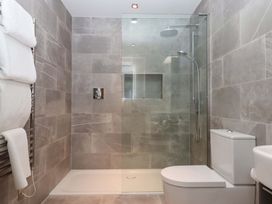 A bathroom with a shower and toilet at Duke's Barn Blackawton near Dartmouth