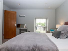 A bedroom with a bed and desk at Duke's Barn Blackawton near Dartmouth