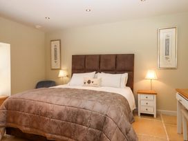 A bedroom with a bed and nightstand at Duke's Barn Blackawton near Dartmouth