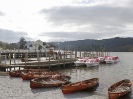 A dock with boats at The Landings in Windermere