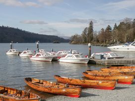 A row of boats at a dock by the water at Catbells in Windermere