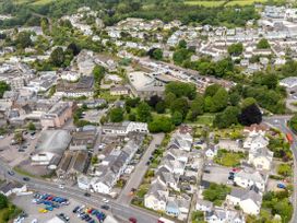 An aerial view of a town with houses and parking areas at The Sundial in St Austell