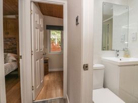 A bathroom with a sink and toilet at Owls Nook Lodge, Langdale 9, White Cross Bay near Windermere