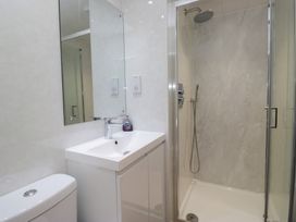 A bathroom with a sink, toilet, and shower at Owls Nook Lodge Langdale 9, White Cross Bay near Windermere