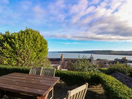 An outdoor seating area overlooking the sea at Zenobia in New Quay
