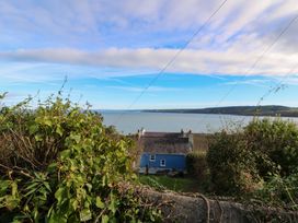 A view of a house near the water at Zenobia in New Quay