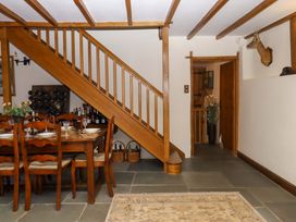 A dining room with a table and chairs at Higher Wadden Farm Southleigh