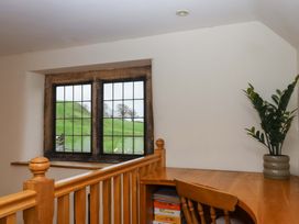 A room with a desk and window at Higher Wadden Farm Southleigh