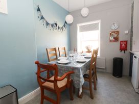A dining room with a table set for meal at Ferncliffe
