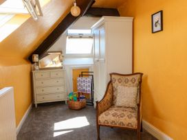 An attic with a chair and dresser at Ferncliffe in 